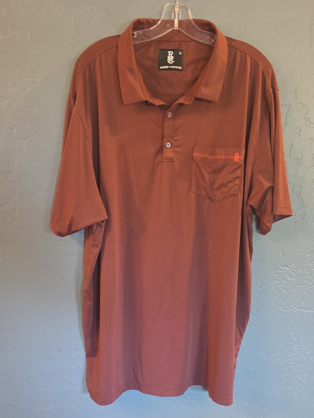 Raised By Coyotes Men's Rust Short-Sleeve Pocket Polo